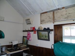 *South wall of kitchen - asbestos panels-r